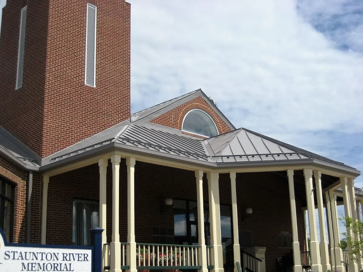 Skilled roofing craftsmen working on a residential roof in Mostoller